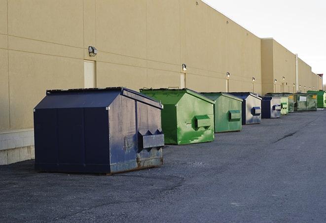 an aerial view of construction dumpsters placed on a large lot in East Palo Alto